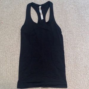 Size 4. lululemon black swiftly tank